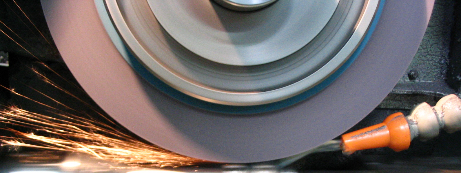 Grinding wheel finishing metal